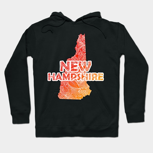 Colorful mandala art map of New Hampshire with text in red and orange Hoodie by Happy Citizen